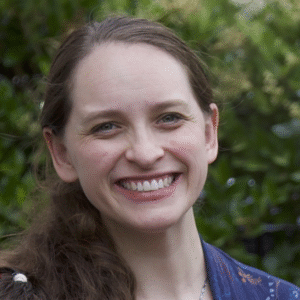 Profile Picture of Site Creator Maddie Sea with Green background for Home Page of Permaculture Systems in the Home